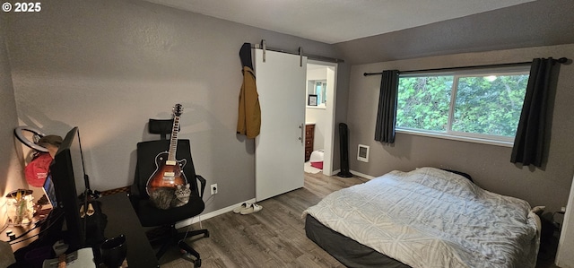 94191 Seaview Ln, Gold Beach, OR 97444 - bedroom with wood finished floors, vaulted ceiling, and baseboards