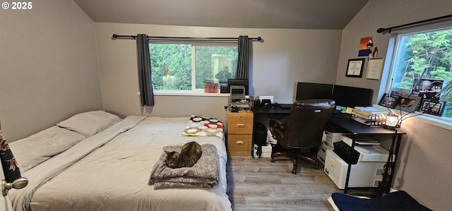 94191 Seaview Ln, Gold Beach, OR 97444 - bedroom with wood finished floors, vaulted ceiling, and a desk