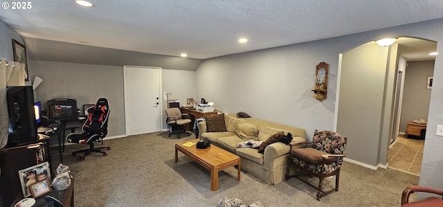 94191 Seaview Ln, Gold Beach, OR 97444 - carpeted living room featuring arched walkways, recessed lighting, and a textured ceiling