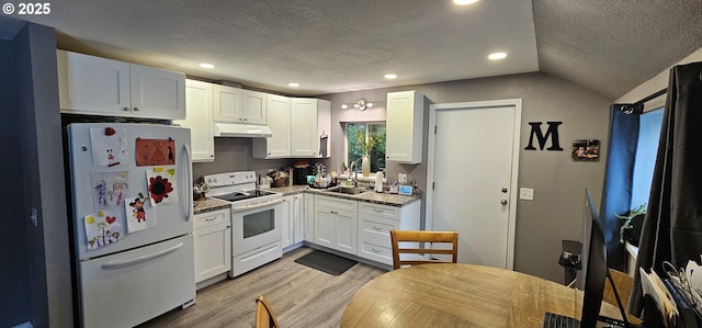 94191 Seaview Ln, Gold Beach, OR 97444 - kitchen featuring white appliances, a sink, a textured ceiling, under cabinet range hood, and light wood-type flooring