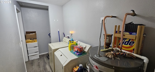 94191 Seaview Ln, Gold Beach, OR 97444 - clothes washing area with washing machine and dryer, wood finished floors, and water heater