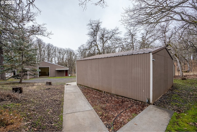 view of side of home with an outbuilding