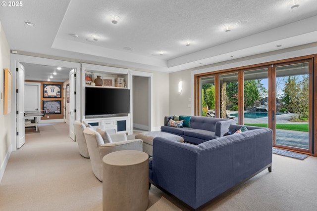 5390 NW Roanoke Ln, Portland, OR 97229 - living room with light colored carpet, a textured ceiling, and a raised ceiling