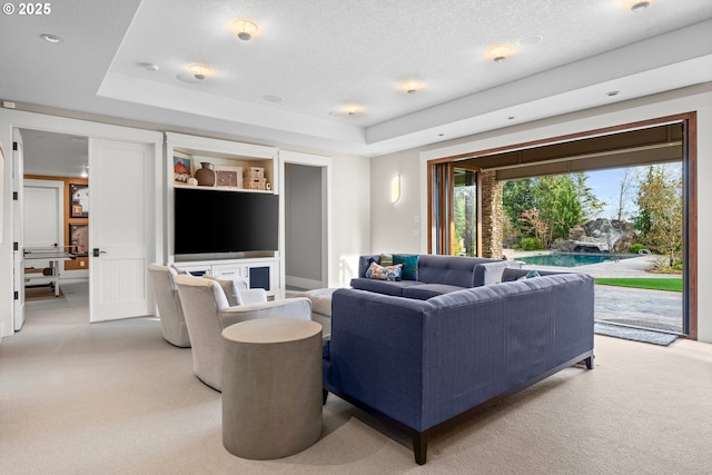 5390 NW Roanoke Ln, Portland, OR 97229 - living area featuring light colored carpet, a raised ceiling, and a textured ceiling
