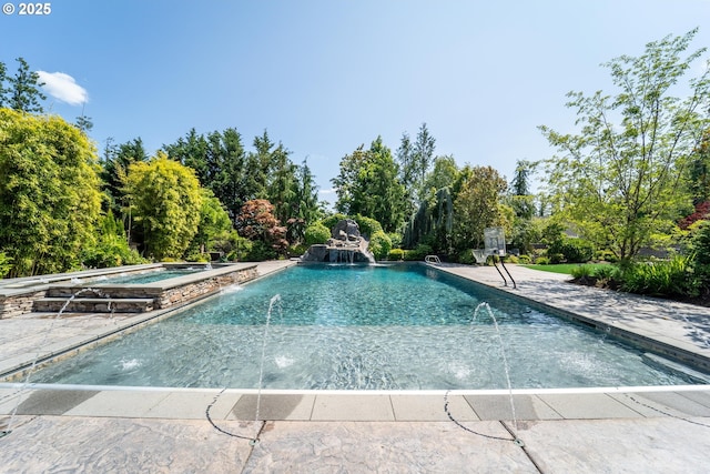 5390 NW Roanoke Ln, Portland, OR 97229 - view of swimming pool featuring view of scattered trees, a pool with connected hot tub, and a patio