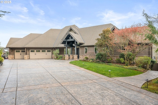 5390 NW Roanoke Ln, Portland, OR 97229 - craftsman house featuring stone siding, an attached garage, driveway, and a front lawn