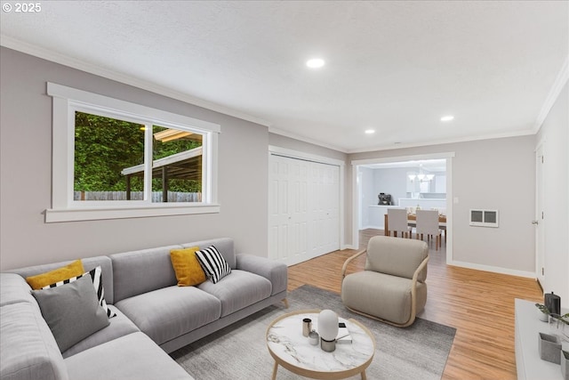 108 Lomor Dr, Longview, WA 98632 - living area with light wood-style flooring, crown molding, a chandelier, recessed lighting, and baseboards