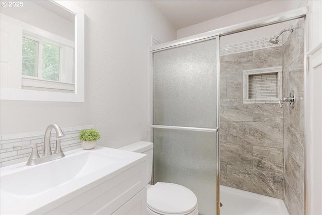 108 Lomor Dr, Longview, WA 98632 - bathroom with toilet, a shower stall, vanity, and tasteful backsplash