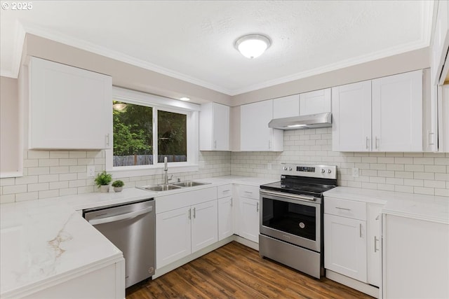 108 Lomor Dr, Longview, WA 98632 - kitchen with appliances with stainless steel finishes, under cabinet range hood, a sink, white cabinetry, and backsplash