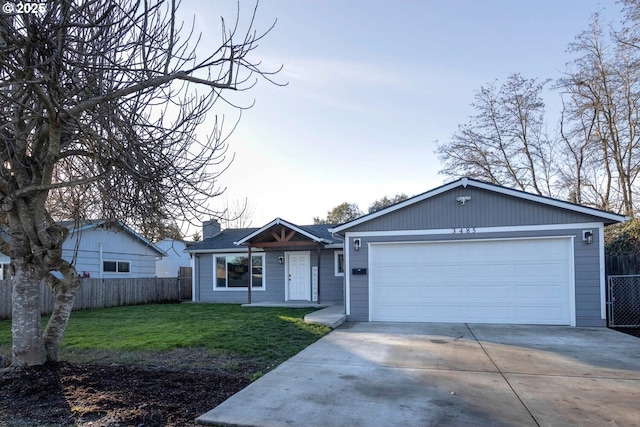 ranch-style house featuring a front yard and a garage