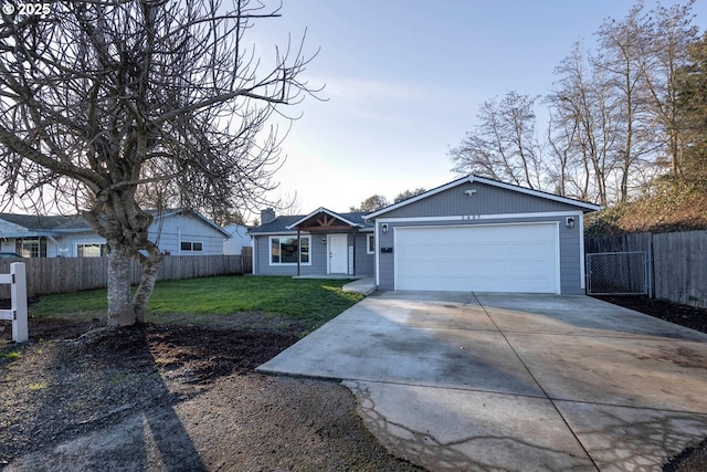 ranch-style house with a front yard and a garage