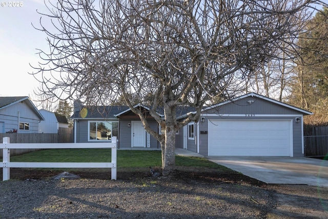 ranch-style house featuring a front lawn and a garage