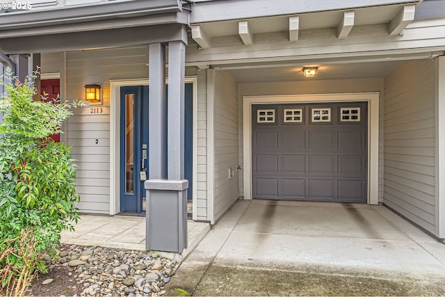 view of exterior entry featuring a garage