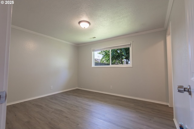 4738 NE Royal Oak Ct, Salem, OR 97301 - empty room with wood finished floors, a textured ceiling, crown molding, and baseboards