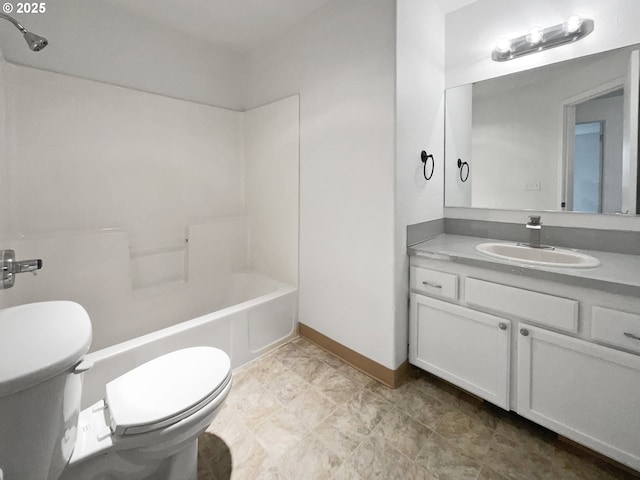 bathroom with shower / bath combination, toilet, vanity, and baseboards