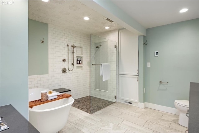 2869 SW Champlain Dr, Portland, OR 97205 - full bath with walk in shower, a soaking tub, recessed lighting, toilet, and tile walls