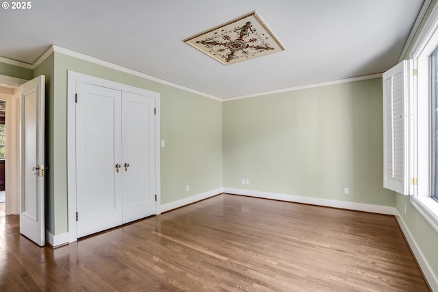 2869 SW Champlain Dr, Portland, OR 97205 - unfurnished bedroom featuring wood finished floors, crown molding, and baseboards