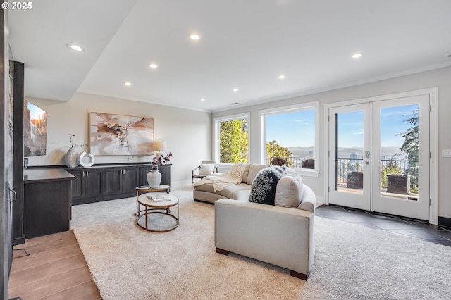 2869 SW Champlain Dr, Portland, OR 97205 - living room featuring recessed lighting, ornamental molding, light carpet, light tile patterned flooring, and baseboards