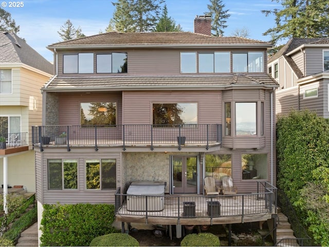 2869 SW Champlain Dr, Portland, OR 97205 - rear view of property with a chimney, a balcony, and french doors