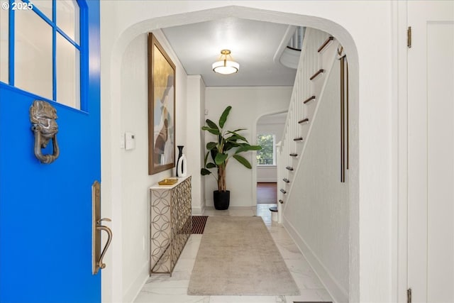 2869 SW Champlain Dr, Portland, OR 97205 - foyer with stairway, baseboards, and arched walkways