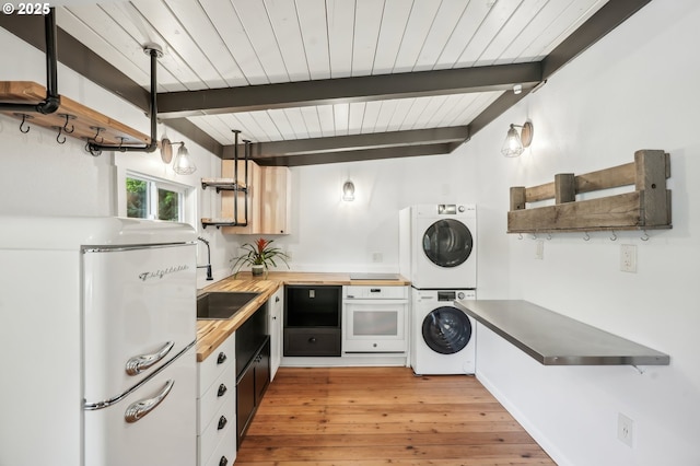 28831 SE Woods Rd, Eagle Creek, OR 97022 - laundry area featuring stacked washer / dryer, light wood-style flooring, and wooden ceiling