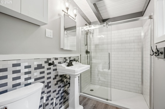 28831 SE Woods Rd, Eagle Creek, OR 97022 - full bath featuring a shower stall, toilet, tile walls, a wainscoted wall, and wood finished floors