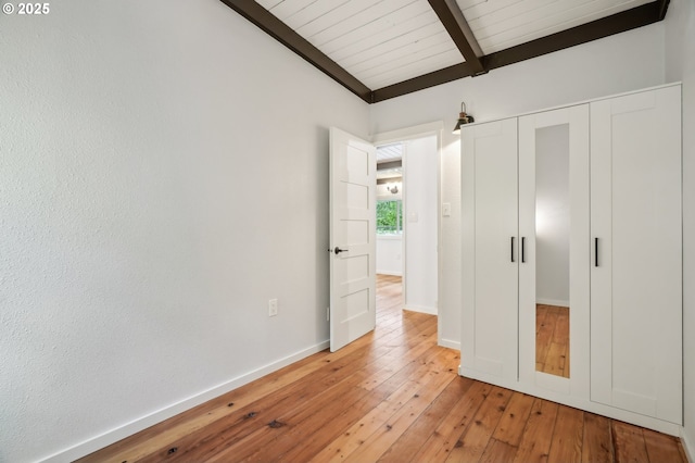 28831 SE Woods Rd, Eagle Creek, OR 97022 - unfurnished bedroom featuring light wood-type flooring, baseboards, a closet, and wood ceiling