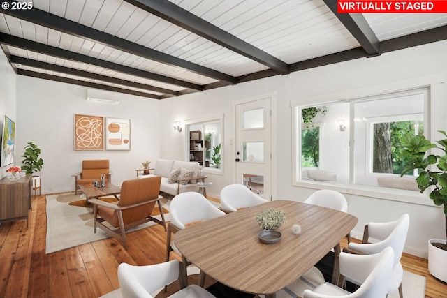 28831 SE Woods Rd, Eagle Creek, OR 97022 - dining room featuring light wood finished floors, a wall mounted air conditioner, wooden ceiling with exposed beams, and baseboards
