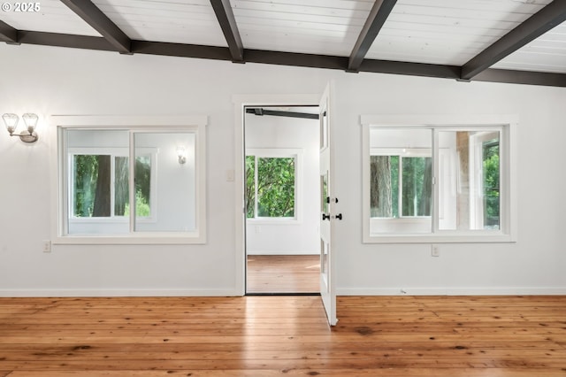 28831 SE Woods Rd, Eagle Creek, OR 97022 - unfurnished room with beam ceiling, healthy amount of natural light, baseboards, and hardwood / wood-style flooring