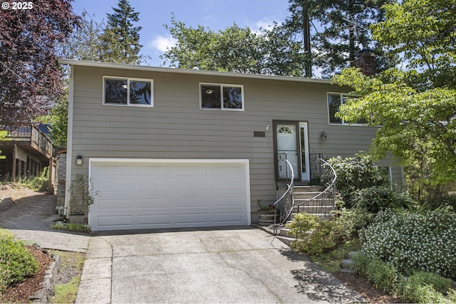 11118 SW 51st Ave, Portland, OR 97219 - raised ranch with a garage, concrete driveway, and a chimney