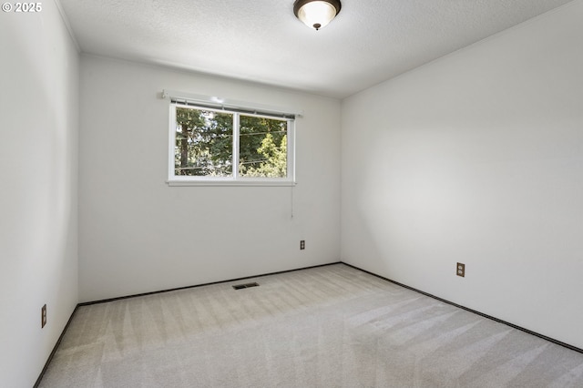 11118 SW 51st Ave, Portland, OR 97219 - empty room featuring carpet flooring and a textured ceiling
