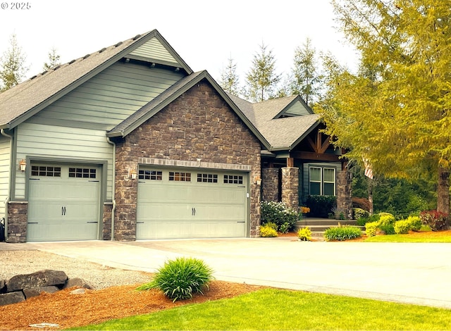 craftsman-style house with a garage, concrete driveway, roof with shingles, and stone siding