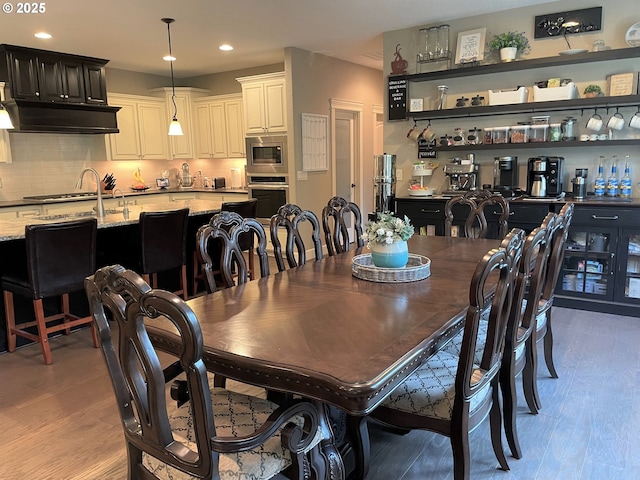 dining room featuring recessed lighting and light wood finished floors
