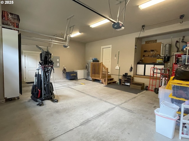 garage with a garage door opener and electric panel