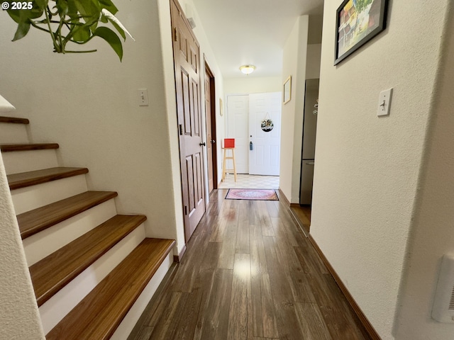 3125 NE Flintlock Pl, Corvallis, OR 97330 - hall featuring dark wood-style floors, stairs, and baseboards