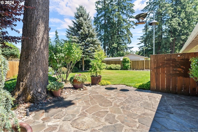 view of patio / terrace featuring fence