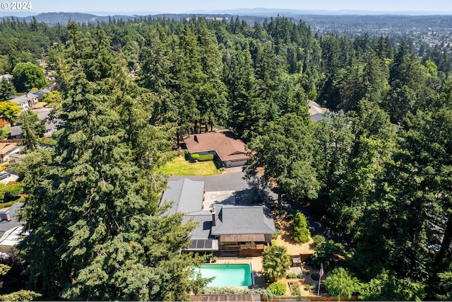 bird's eye view featuring a forest view