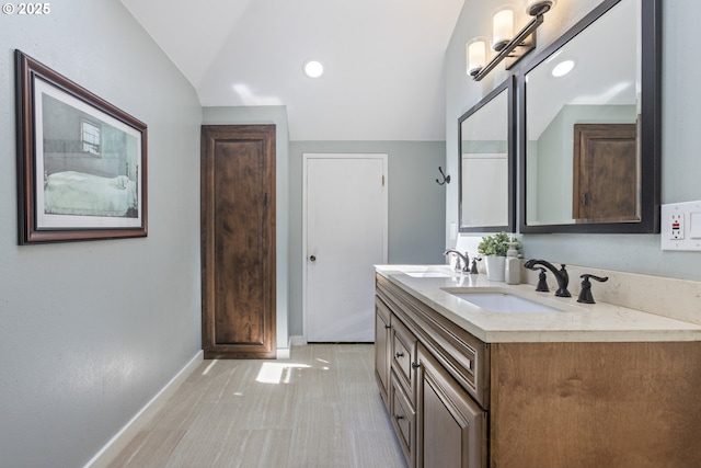 28825 SW Grahams Ferry Rd, Wilsonville, OR 97070 - bathroom featuring double vanity, vaulted ceiling, and recessed lighting