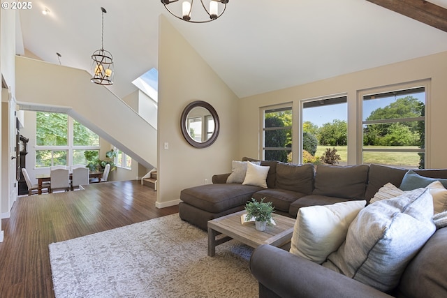 28825 SW Grahams Ferry Rd, Wilsonville, OR 97070 - living area with high vaulted ceiling, a chandelier, wood finished floors, and stairs