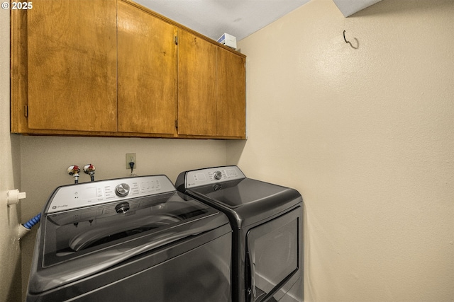 6516 SW Locust St, Portland, OR 97223 - washroom featuring cabinet space and washing machine and clothes dryer