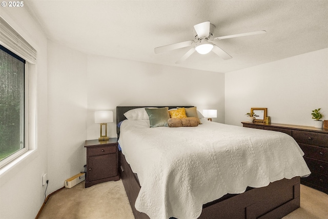 6516 SW Locust St, Portland, OR 97223 - bedroom featuring light carpet, a ceiling fan, and a baseboard radiator