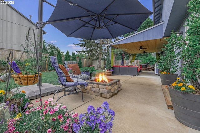 6516 SW Locust St, Portland, OR 97223 - view of patio / terrace with a ceiling fan and an outdoor living space with a fire pit