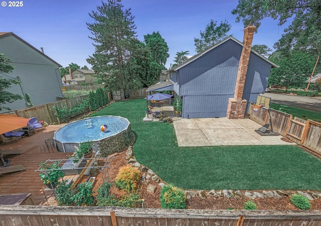 6516 SW Locust St, Portland, OR 97223 - fenced backyard with a patio area