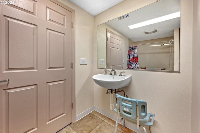 bathroom featuring sink and tile patterned flooring