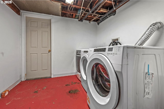 clothes washing area featuring washing machine and dryer