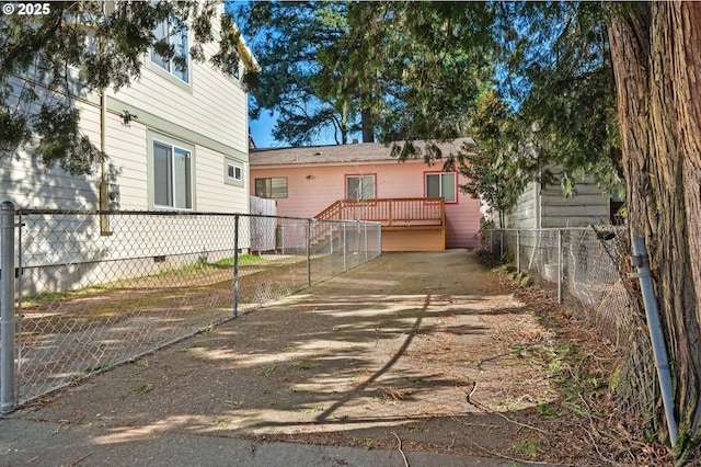 rear view of house with a wooden deck