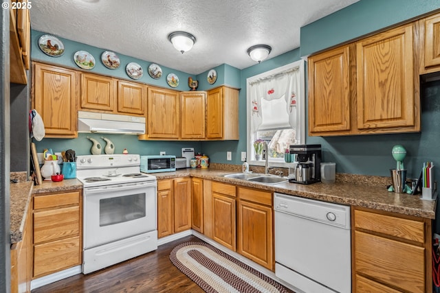 623 10th Ave, Albany, OR 97321 - kitchen featuring white appliances, under cabinet range hood, dark wood-style floors, and a textured ceiling