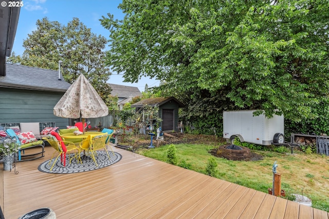623 10th Ave, Albany, OR 97321 - wooden terrace with a storage unit and outdoor dining space