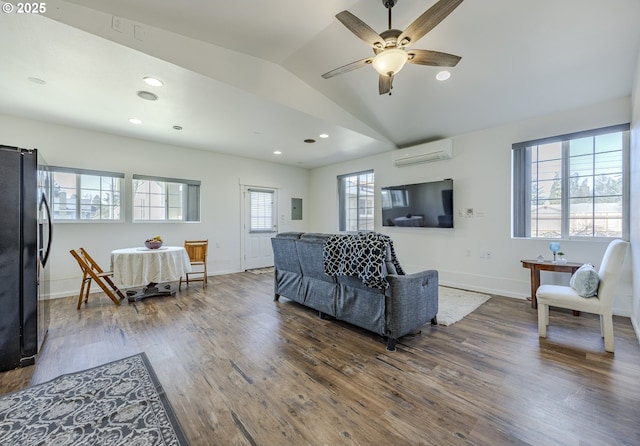 living area with baseboards, dark wood finished floors, lofted ceiling, recessed lighting, and a wall mounted air conditioner