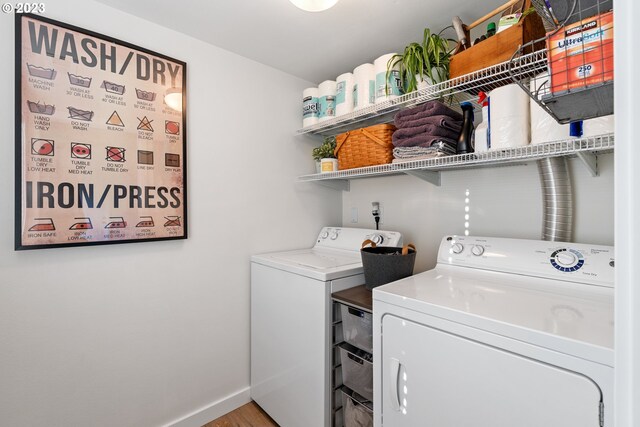 1437 Greentree Cir, Lake Oswego, OR 97034 - washroom with separate washer and dryer, baseboards, and light wood-type flooring